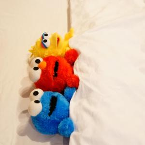 a group of stuffed animals sitting on a bed at Koti Sopo Universal Bay 2 by Liaison in Osaka