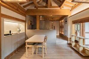a kitchen and dining room with a table and chairs at Luxury hanok with private bathtub - SN06 in Seoul