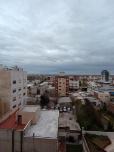 a view of a city with buildings at Departamento del centro in Neuquén