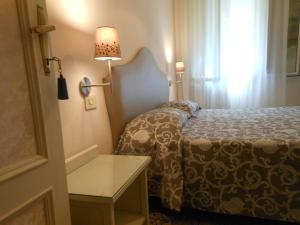 Postel nebo postele na pokoji v ubytování Hotel Stipino