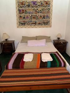 En eller flere senge i et værelse på Cabaña La Apacheta Cachi Salta