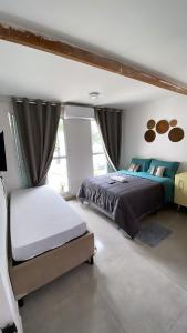 מיטה או מיטות בחדר ב-Blue Hale