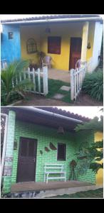 una casa verde y amarilla con una valla blanca en Mirante toca da raposa en Meruoca