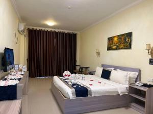 City Comfort Hotel Phnom Penh Airport tesisinde bir odada yatak veya yataklar