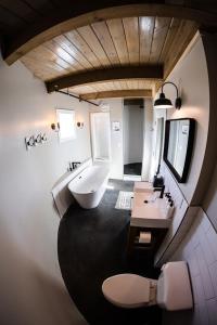 a bathroom with a tub and a sink and a toilet at Silo Suite 4- Near Zion National Park in La Verkin
