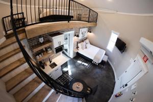 an overhead view of a living room with a spiral staircase at Silo Suite 4- Near Zion National Park in La Verkin