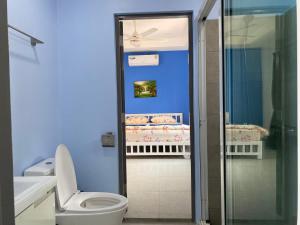 a blue bathroom with a toilet and a shower at walking st 1km south pattaya 5BR modern villa in Pattaya Central