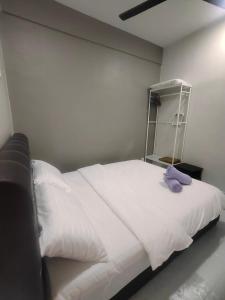 Ένα ή περισσότερα κρεβάτια σε δωμάτιο στο Mimpi D View Homestay