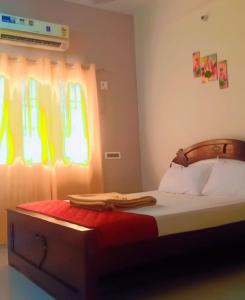 a bedroom with a bed and a window at Private 4 BHK Villa with WiFi, Swimming Pool, BBQ in Chennai