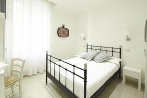 A bed or beds in a room at Affittacamere Arosio