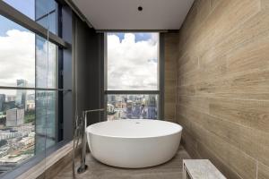 a bath tub in a bathroom with a large window at Renaissance Shenzhen Bay Hotel in Shenzhen