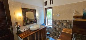 a bathroom with a sink and a mirror at Villa Les Sables Blancs, GILI AIR in Gili Air +36 photos