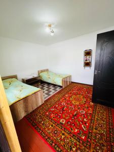 Postel nebo postele na pokoji v ubytování Guest House KAGAN