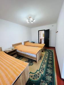 Postel nebo postele na pokoji v ubytování Guest House KAGAN