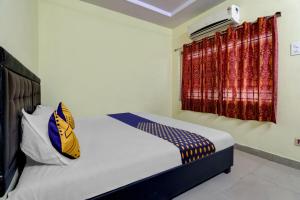 Cama ou camas em um quarto em SPOT ON Unik Residency