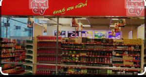 a store with a large assortment of goods on display at Calm Palace in Weligama