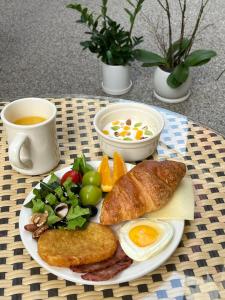 a plate of breakfast food with eggs bread and vegetables at SimpleStay Hotel in Jongno in Seoul