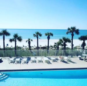 a view of the beach from the balcony of a resort at Kimberly Villa in Panama City Beach