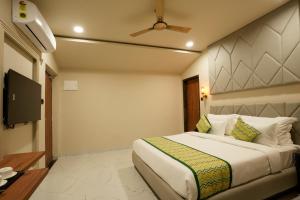 Voodi või voodid majutusasutuse Bageecha Resort toas