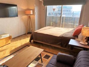 Säng eller sängar i ett rum på RLis-house Osaka Dome City - Vacation STAY 10734