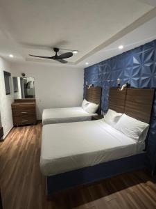 En eller flere senge i et værelse på Hotel don Bosco