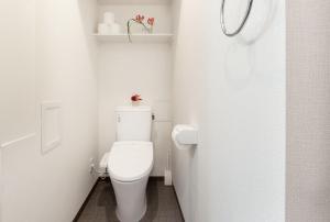 a bathroom with a white toilet in a room at RLiS-house Shin-Osaka Kita - Vacation STAY 9521 in Osaka