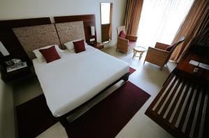 Letto o letti in una camera di Hotel Devaragam by K P Namboodiri's