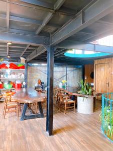 a dining room with wooden tables and chairs at Lego Homestay Tam Đảo Venuestay in Vĩnh Phúc