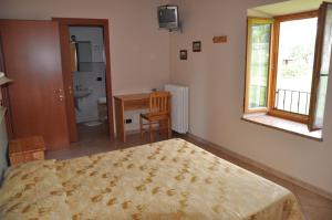 Postel nebo postele na pokoji v ubytování Agriturismo Corte dei Fiori + 28 fotografií