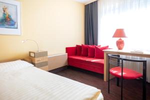 Postel nebo postele na pokoji v ubytování Roomingtons Lüneburger Heide