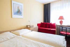 Postel nebo postele na pokoji v ubytování Roomingtons Lüneburger Heide