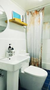 a white bathroom with a sink and a toilet at Private House in Mapo in Seoul