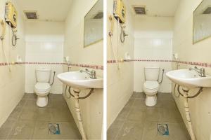 2 foto di un bagno con due lavandini e servizi igienici di OYO 90892 L&E Hotel a Seremban