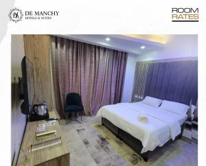 DE MANCHY HOTELS & SUITES的电视和/或娱乐中心