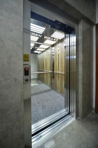 a hallway in a building with a glass door at Saygın Apartments in Istanbul