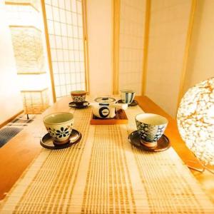 a wooden table with three cups on top of it at 直达-池袋-2分钟 车站徒步6分钟 3bedrooms in Tokyo