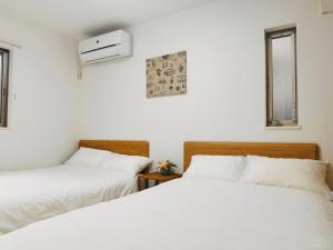 東京にあるMISTELのベッド2台が隣同士に設置された部屋です。
