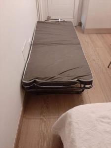 two beds sitting on the floor in a room at Bilocali e Mono al mare in Senigallia