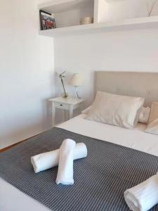 מיטה או מיטות בחדר ב-Loft By Vialia