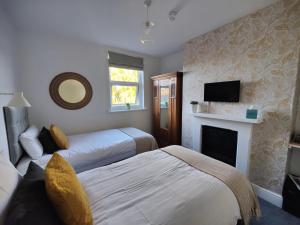 Postel nebo postele na pokoji v ubytování The Wincheap B&B