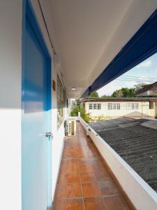 a view from the outside of a house with a roof at RQ North Pattaya by Collection O in Pattaya North +23 photos