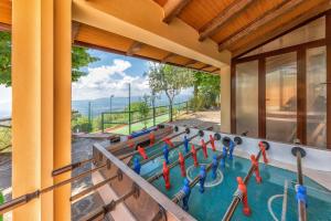 Blick auf den Pool von einem Haus aus in der Unterkunft Villa Querceto With Pool e Tennis Private - Happy Rentals in Loro Ciuffenna