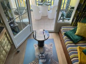a view of a room with a table on a floor at *A setting between Dordogne and swimming pool* in Argentat