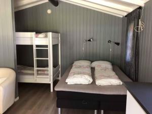 a small room with two bunk beds in it at Sølvgarden Camping in Rysstad