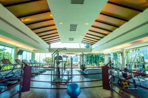 a gym with a lot of treadmills and exercise equipment at Phi Phi Banyan Villa in Phi Phi Don