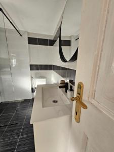 a white bathroom with a sink and a shower at St Anthony's House with Parking in Zagreb +13 photos