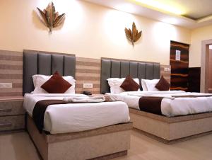 Postel nebo postele na pokoji v ubytování Hotel Mahajan International, Delhi Airport