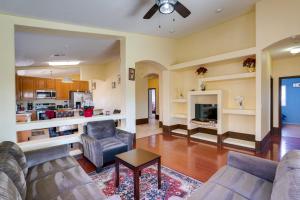 a living room with two couches and a fireplace at 7 Mi to Chase Field Phoenix Home with Patio! in Phoenix