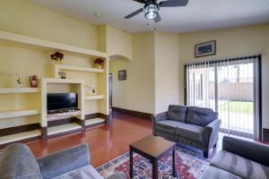 a living room with a couch and chairs and a tv at 7 Mi to Chase Field Phoenix Home with Patio! in Phoenix