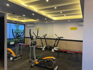 a gym with several tread machines in a room at City 2 in Alanya